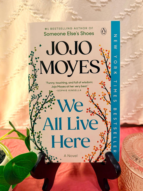 We All Live Here by Jojo Moyes paperback book cover